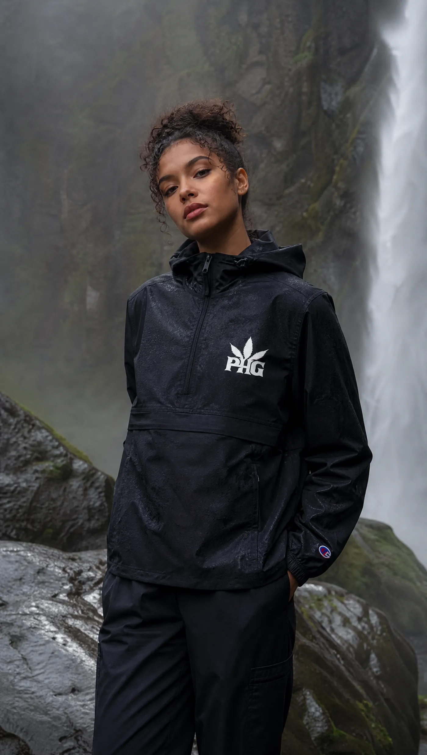 A member in a black PotHead Gang anorak against a dark backdrop.